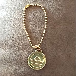 Gold Big Buddha bag fob charm tag